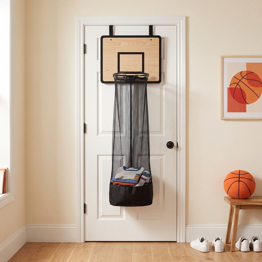 The Layup Hoop over-the-door basketball laundry hamper hanging on a bedroom door